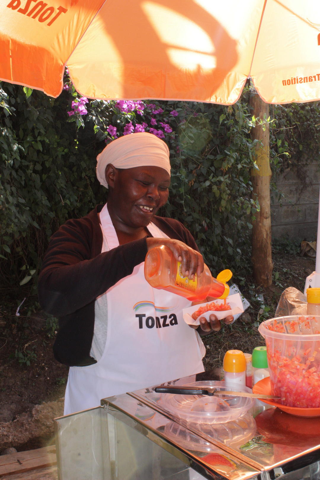 Smiling street food vendor