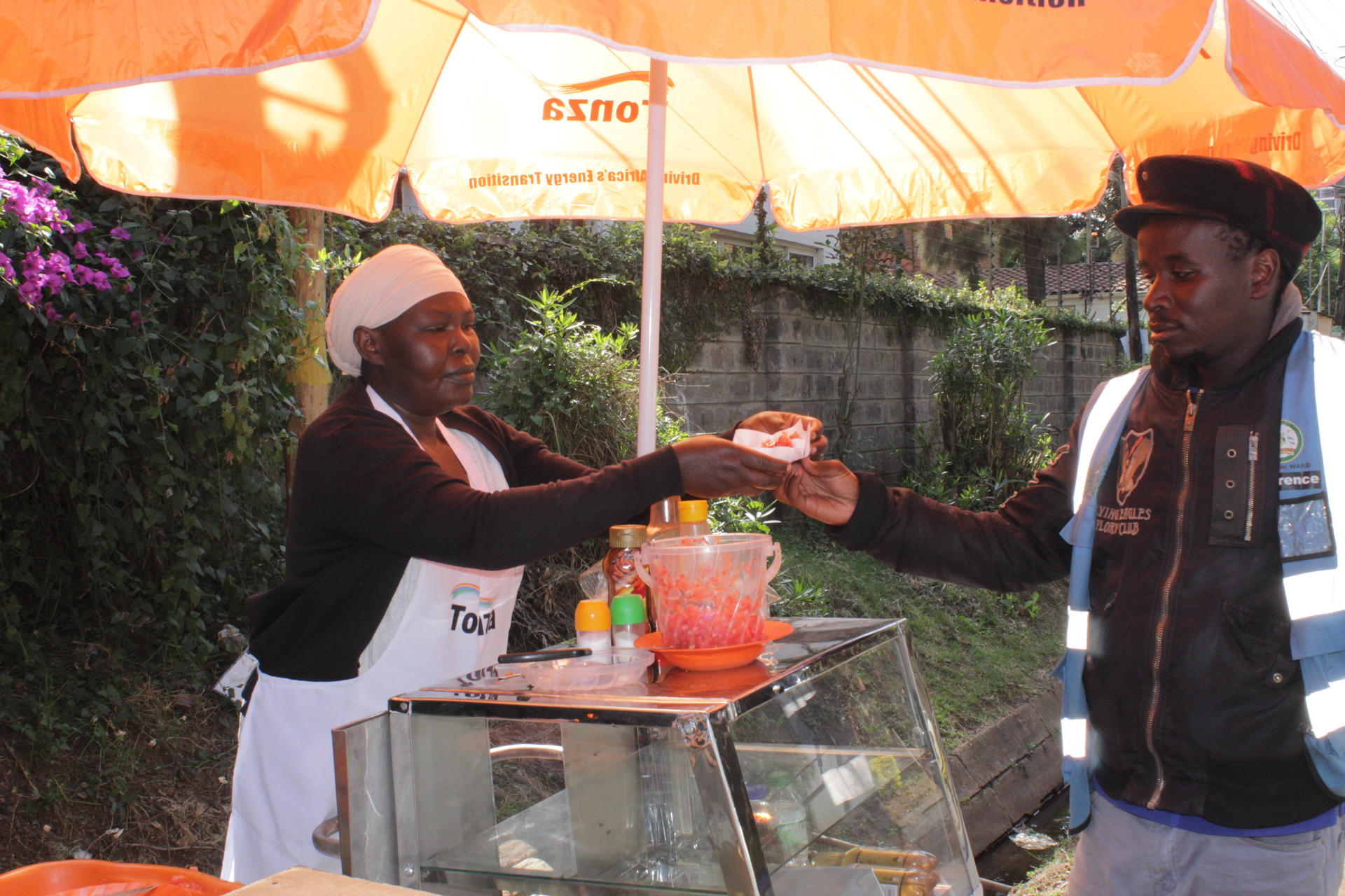 Nairobi street food vendor serving a customer